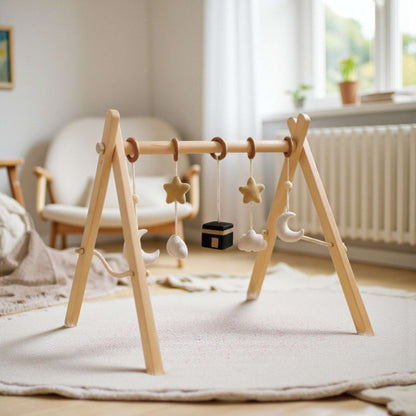 Wooden baby play arch with hanging toys and Islamic symbols, natural wood and soft felt, an ideal new baby gift
