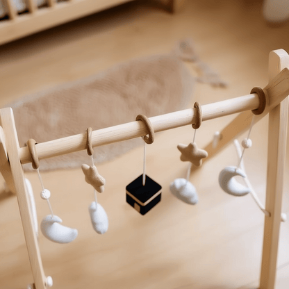 Wooden Kaaba discovery arch with natural wooden hanging toys and gentle Islamic symbols